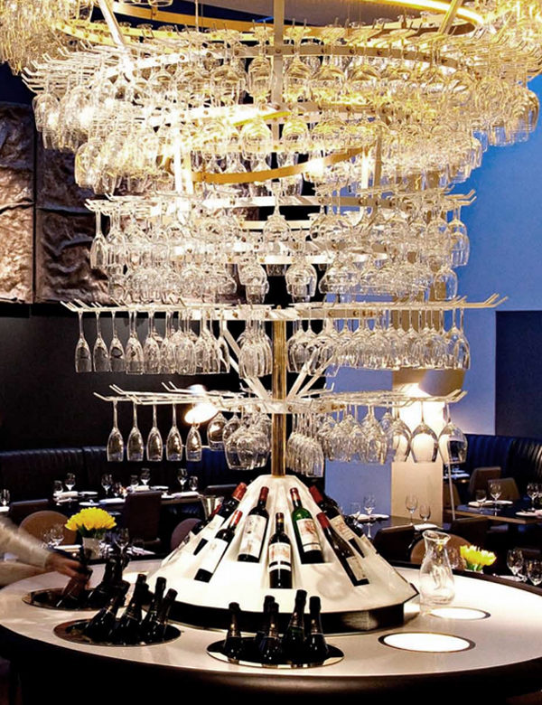Chandelier made of glasses at Avenue, London. Interiors designed by Russell Sage Studio Ltd.