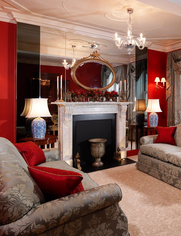A mirrored fireplace in a suite at The Goring Hotel, London. Interiors designed by Russell Sage Studio Ltd.