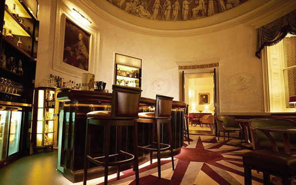 A circular bar area in The Lansdowne Club. Interiors designed by Russell Sage Studio Ltd.