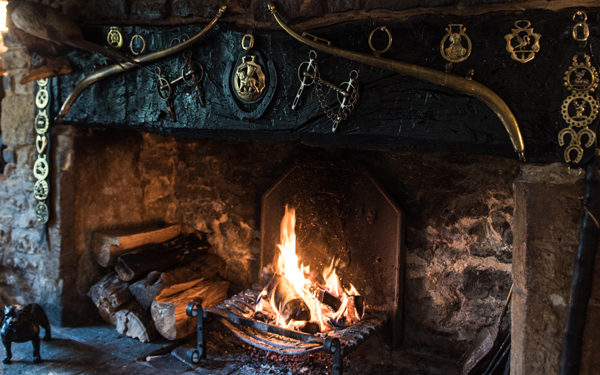 Open fire at The Bull Pub. Interiors designed by Russell Sage Studio Ltd.